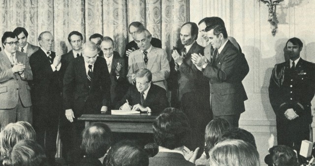 President Jimmy Carter signing legislation.